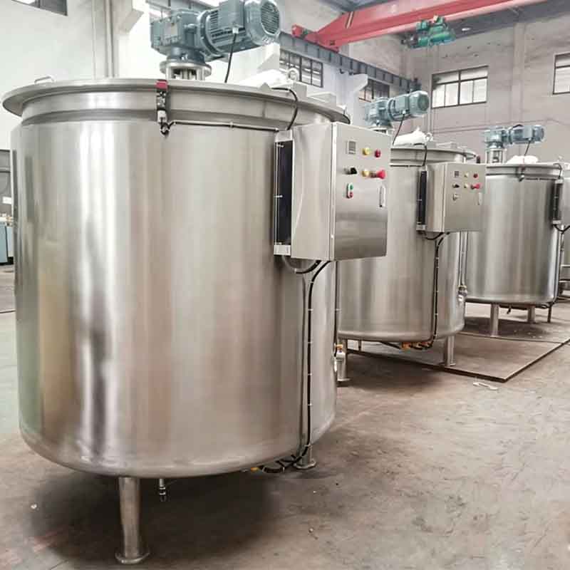 Commercial-grade chocolate tanks in a real food production facility.