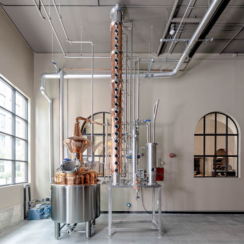 High-efficiency commercial still system, combining traditional pot still design with modern column distillation.