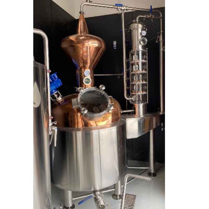 Versatile craft distillery setup, combining traditional pot still design with modern distillation technology.