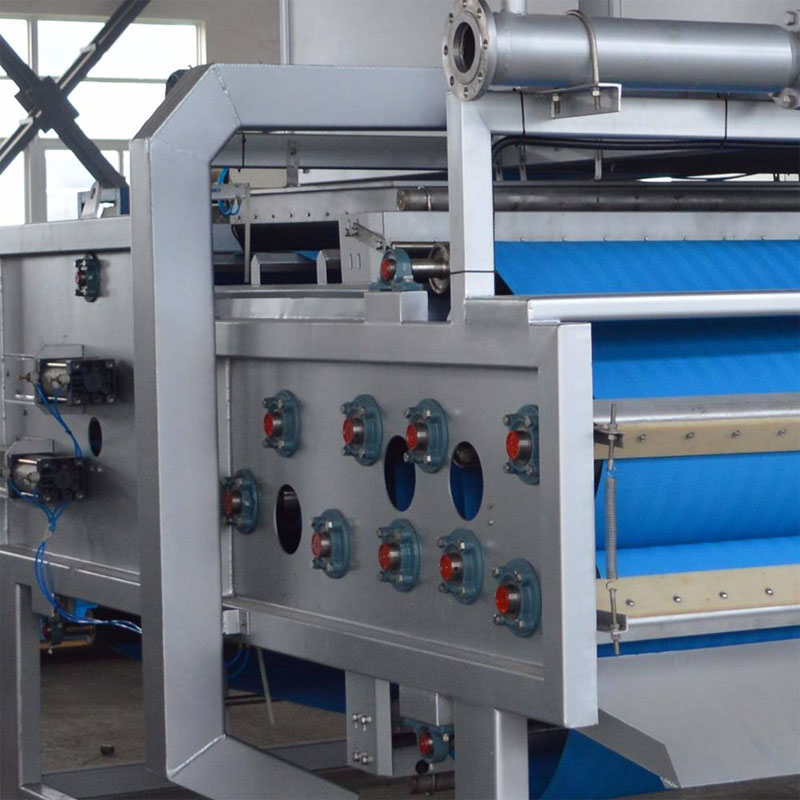 Municipal sludge dewatering system using belt filter press