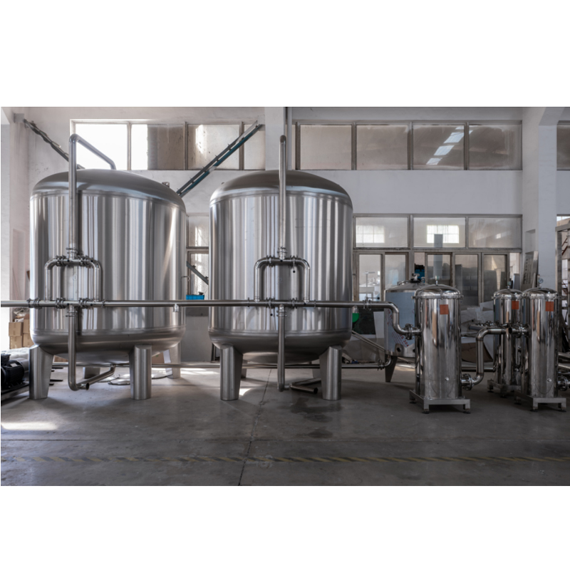 Large-scale RO system with stainless steel tanks for industrial water production.