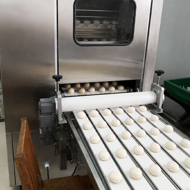 Dough dividing machine for automatic bakery processing