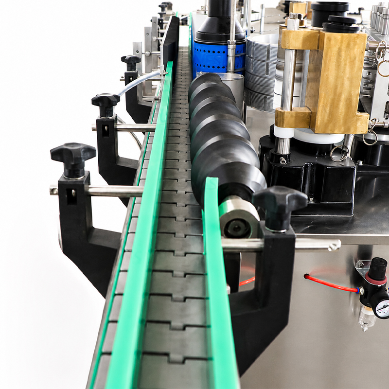 Close-up shot of conveyor and labeling working mechanism of jar labeling machine
