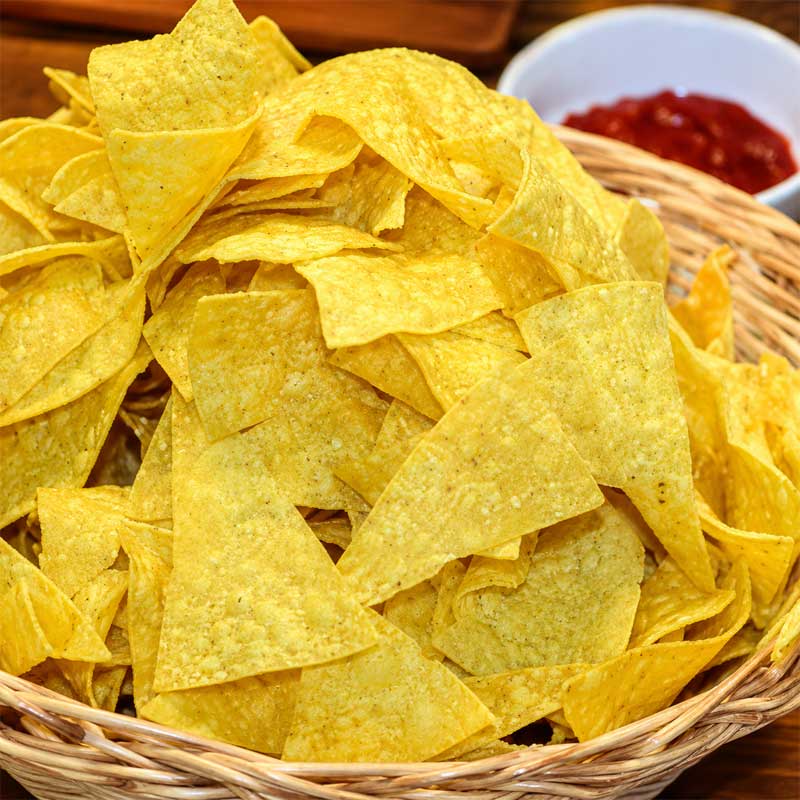 Crispy fried corn tortilla chips for commercial snack production Crispy fried corn tortilla chips for commercial snack production