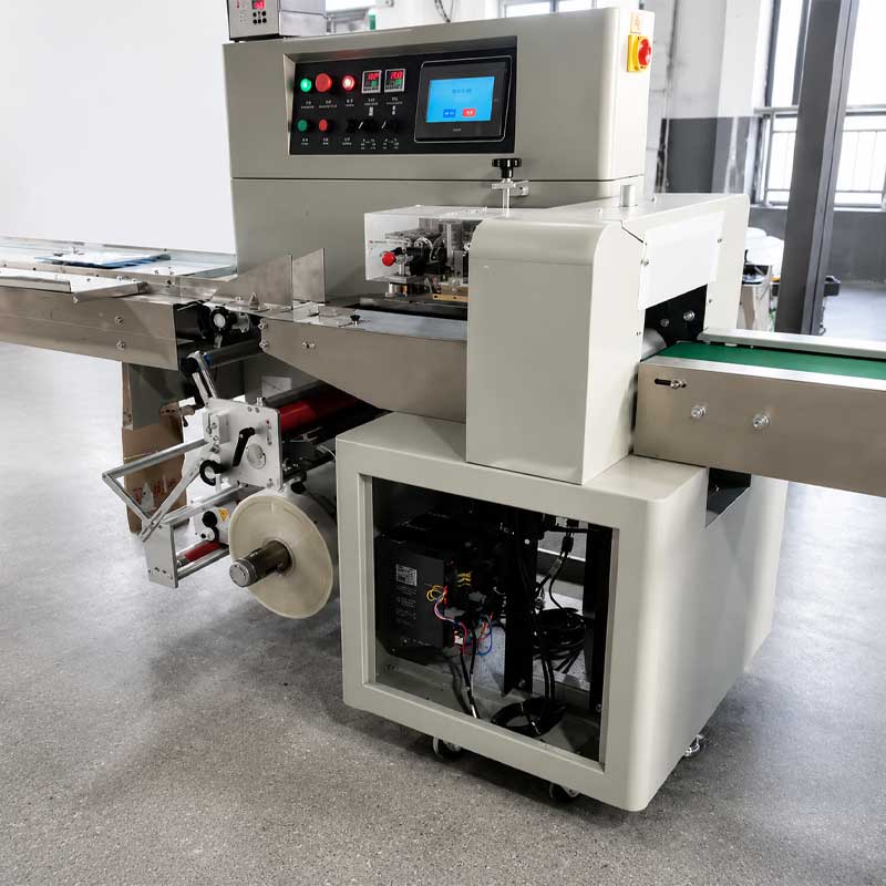 Automatic popsicle flow packing machine operating in food factory Automatic popsicle flow packing machine operating in food factory