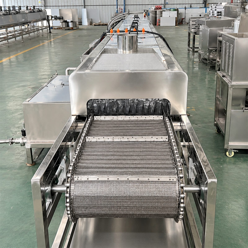 Stainless steel conveyor belt inside an industrial spray cleaning machine Stainless steel conveyor belt inside an industrial spray cleaning machine